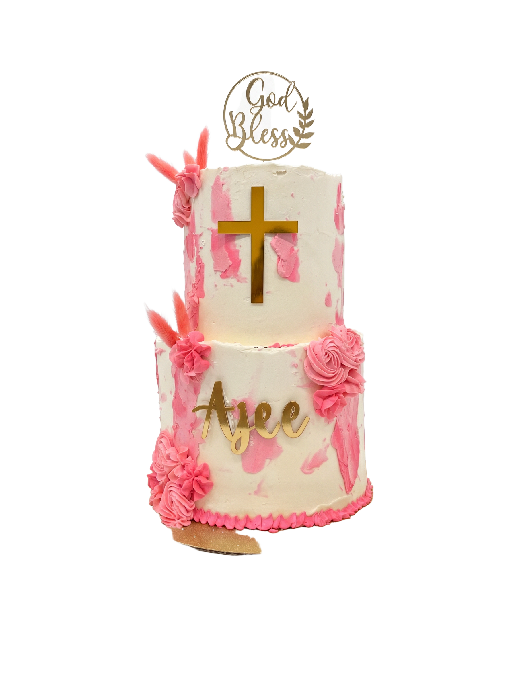 Two-tier white and pink baptism cake with gold cross and God Bless topper